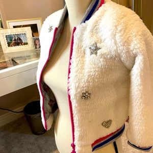 White Jojo Siwa bomber jacket with stars